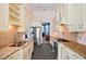 Contemporary kitchen featuring granite countertops, stainless steel appliances, and custom cabinetry at 119 Cardinal Crest Ct, Pittsboro, NC 27312