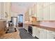 Modern kitchen with stainless steel appliances, granite countertops, and custom cabinetry at 119 Cardinal Crest Ct, Pittsboro, NC 27312