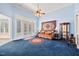 Open living area boasts carpeting, ceiling fan, and exterior view at 119 Cardinal Crest Ct, Pittsboro, NC 27312