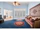 Spacious living area with ceiling fan, carpet, and ample natural light at 119 Cardinal Crest Ct, Pittsboro, NC 27312