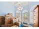 Bright living room with coffered ceiling, arched windows, and plantation shutters at 119 Cardinal Crest Ct, Pittsboro, NC 27312