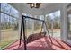 Screened porch with backyard views and swing with great views of the landscape at 119 Cardinal Crest Ct, Pittsboro, NC 27312