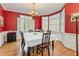 Formal dining room with hardwood floors, a bay window, and a classic chandelier at 12 Montcrest Dr, Durham, NC 27713