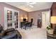 Functional office featuring French doors, hardwood furniture, and a comfortable seating area at 12 Montcrest Dr, Durham, NC 27713