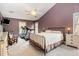 Spacious bedroom with a ceiling fan, two windows, and ample natural light at 12 Montcrest Dr, Durham, NC 27713