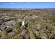 Aerial shot of the property in a wooded area near the city at 122 W Woodridge Dr, Durham, NC 27707
