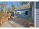 Wooden deck with a built-in bench overlooking a lush backyard at 122 W Woodridge Dr, Durham, NC 27707