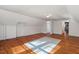 Hardwood floors add warmth and character to this spacious bonus room upstairs at 122 W Woodridge Dr, Durham, NC 27707