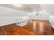 Large bonus room with hardwood floors, great light and ample space at 122 W Woodridge Dr, Durham, NC 27707