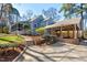 Charming home featuring a screened porch and covered parking surrounded by a well-maintained yard at 122 W Woodridge Dr, Durham, NC 27707