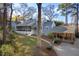 Charming home with a screened porch and covered parking, surrounded by mature trees and lush landscaping at 122 W Woodridge Dr, Durham, NC 27707