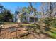 Charming home exterior with a screened porch, garden beds and a well-maintained yard at 122 W Woodridge Dr, Durham, NC 27707