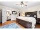 Spacious main bedroom with ensuite bathroom, hardwood floors, and bright windows at 122 W Woodridge Dr, Durham, NC 27707