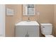 Neutral-toned bathroom with a modern vanity and a clean, functional toilet at 1230 Melrose Dr, Burlington, NC 27217