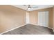 Neutral bedroom with wood floors, ceiling fan and closet at 1230 Melrose Dr, Burlington, NC 27217