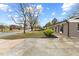 Charming single-story home featuring a paved driveway and manicured landscaping at 1230 Melrose Dr, Burlington, NC 27217