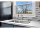 Close-up of the kitchen sink with quartz countertops and stainless steel faucet at 1230 Melrose Dr, Burlington, NC 27217