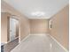 Inviting living room featuring neutral paint, light-filled window, contemporary lighting, and ceramic tile flooring at 1230 Melrose Dr, Burlington, NC 27217