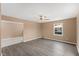 Inviting living room with new gray-tone laminate floors and a ceiling fan at 1230 Melrose Dr, Burlington, NC 27217