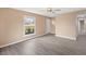 Inviting living room with new gray-tone laminate floors and large windows at 1230 Melrose Dr, Burlington, NC 27217