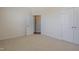 Neutral bedroom features carpet flooring, a walk-in closet, and an ensuite bathroom at 125 Station Dr, Morrisville, NC 27560