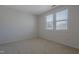 Bedroom with carpet floors and window views at 125 Station Dr, Morrisville, NC 27560