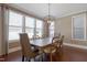 Spacious dining room features natural light, modern lighting and seating for six at 125 Station Dr, Morrisville, NC 27560
