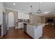 Open concept kitchen showcases a large island with granite countertop and stainless steel appliances at 125 Station Dr, Morrisville, NC 27560