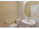 Elegant powder room features stylish wallpaper, modern fixtures, and a pedestal sink at 125 Station Dr, Morrisville, NC 27560
