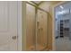 Main bathroom features a tile shower with glass door and a walk-in closet at 125 Station Dr, Morrisville, NC 27560