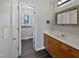 Bathroom featuring a single sink vanity and view into the toilet and shower area at 125 Wynnridge Dr, Angier, NC 27501