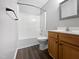 Clean bathroom featuring a tub/shower combination and wood-look vanity at 125 Wynnridge Dr, Angier, NC 27501