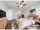 Bright bedroom with a ceiling fan, wood floors, and stylish furnishings at 125 Wynnridge Dr, Angier, NC 27501