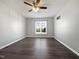Bedroom with wood floors, a large window, and neutral paint at 125 Wynnridge Dr, Angier, NC 27501