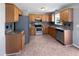 Functional kitchen with wooden cabinets, stainless steel appliances, and neutral countertops at 125 Wynnridge Dr, Angier, NC 27501