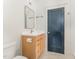Bathroom featuring a modern vanity with a light wood finish and a blue door at 132 Fiori Hill S Dr, Hillsborough, NC 27278