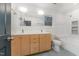 Bathroom with a double vanity, ample lighting, and a separate bathtub at 132 Fiori Hill S Dr, Hillsborough, NC 27278