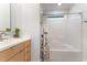 Bright bathroom with a clean, functional layout, featuring a shower-tub combination and modern vanity at 132 Fiori Hill S Dr, Hillsborough, NC 27278