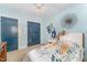 This cozy bedroom has an eye catching bed covering, neutral walls, and carpet to provide a calm and welcoming space at 132 Fiori Hill S Dr, Hillsborough, NC 27278