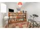 Cozy bonus room with a bookshelf, lamp, and space for entertainment at 132 Fiori Hill S Dr, Hillsborough, NC 27278