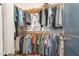 Organized walk-in closet with clothing racks, shelves, and ample storage space at 132 Fiori Hill S Dr, Hillsborough, NC 27278