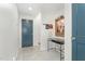 Hallway featuring neutral colored walls with art and access to an adjacent room at 132 Fiori Hill S Dr, Hillsborough, NC 27278