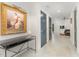 Entry hall featuring neutral colored walls with art and an adjacent sitting room at 132 Fiori Hill S Dr, Hillsborough, NC 27278