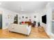Bright and airy living room with hardwood floors, modern furnishings, and lots of natural light at 132 Fiori Hill S Dr, Hillsborough, NC 27278