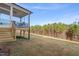Rear exterior view of large yard and screened in porch at 1417 Underbrush Dr, Durham, NC 27703