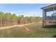 Expansive backyard with a screened porch and mature trees at 1417 Underbrush Dr, Durham, NC 27703