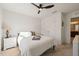 Well-lit bedroom with a ceiling fan, closet, and en-suite bathroom at 1417 Underbrush Dr, Durham, NC 27703