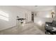 Spacious bonus room featuring neutral carpet, ladder, console and comfortable grey futon couch at 1417 Underbrush Dr, Durham, NC 27703