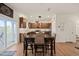Dining area featuring wooden table and chairs, with sliding doors leading to an outdoor space and kitchen access at 1417 Underbrush Dr, Durham, NC 27703