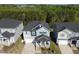 Charming two-story home with a porch, garage, and a well-manicured lawn surrounded by lush trees at 1417 Underbrush Dr, Durham, NC 27703